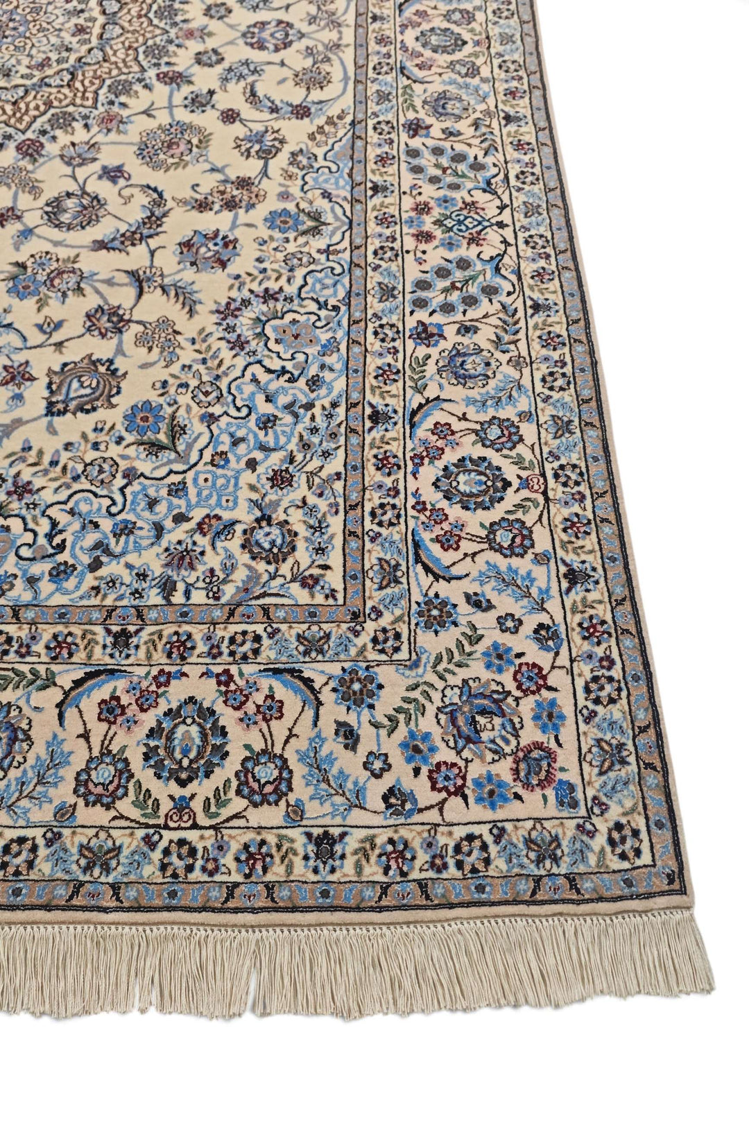 Fringe of sandstone and blue Persian Nain rug