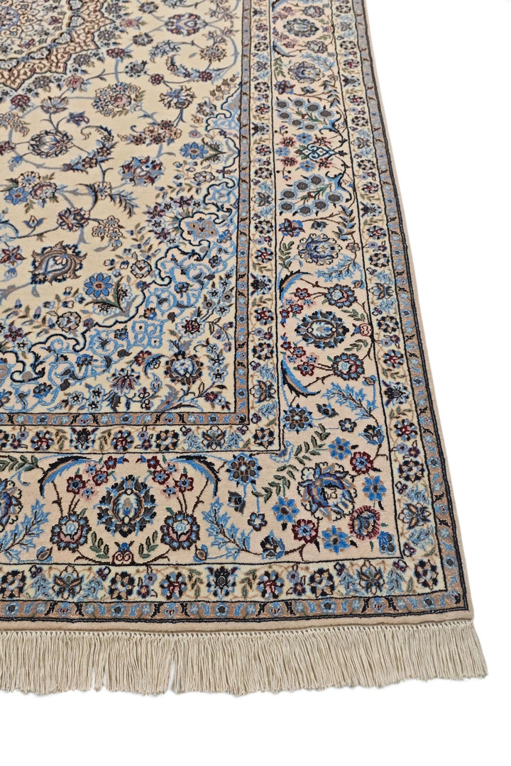 Fringe of sandstone and blue Persian Nain rug