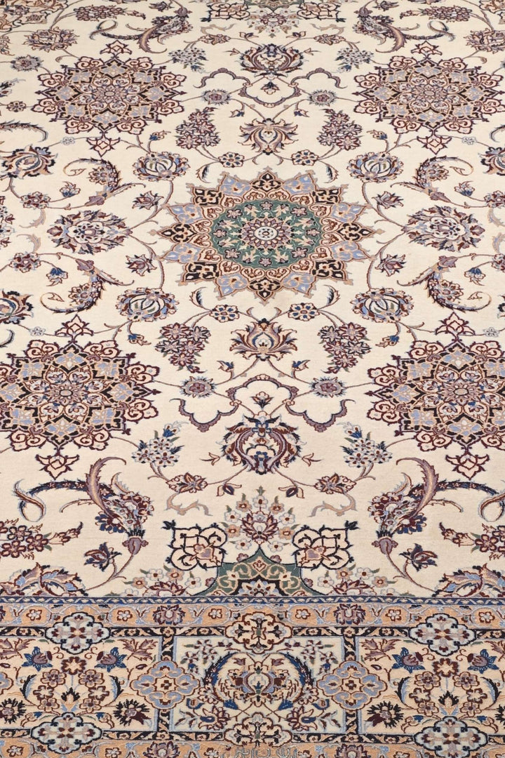 Border detail of ivory beige five medallion Nain rug