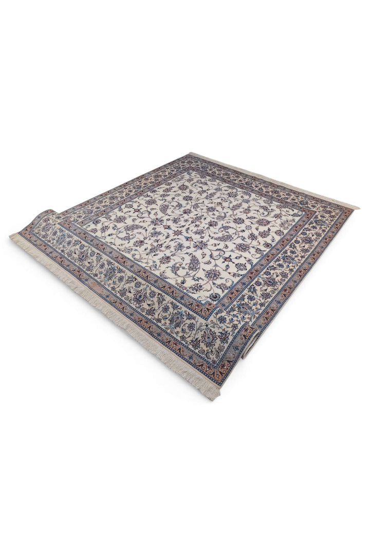 Fringe of ivory and salmon arabesque Persian Nain rug