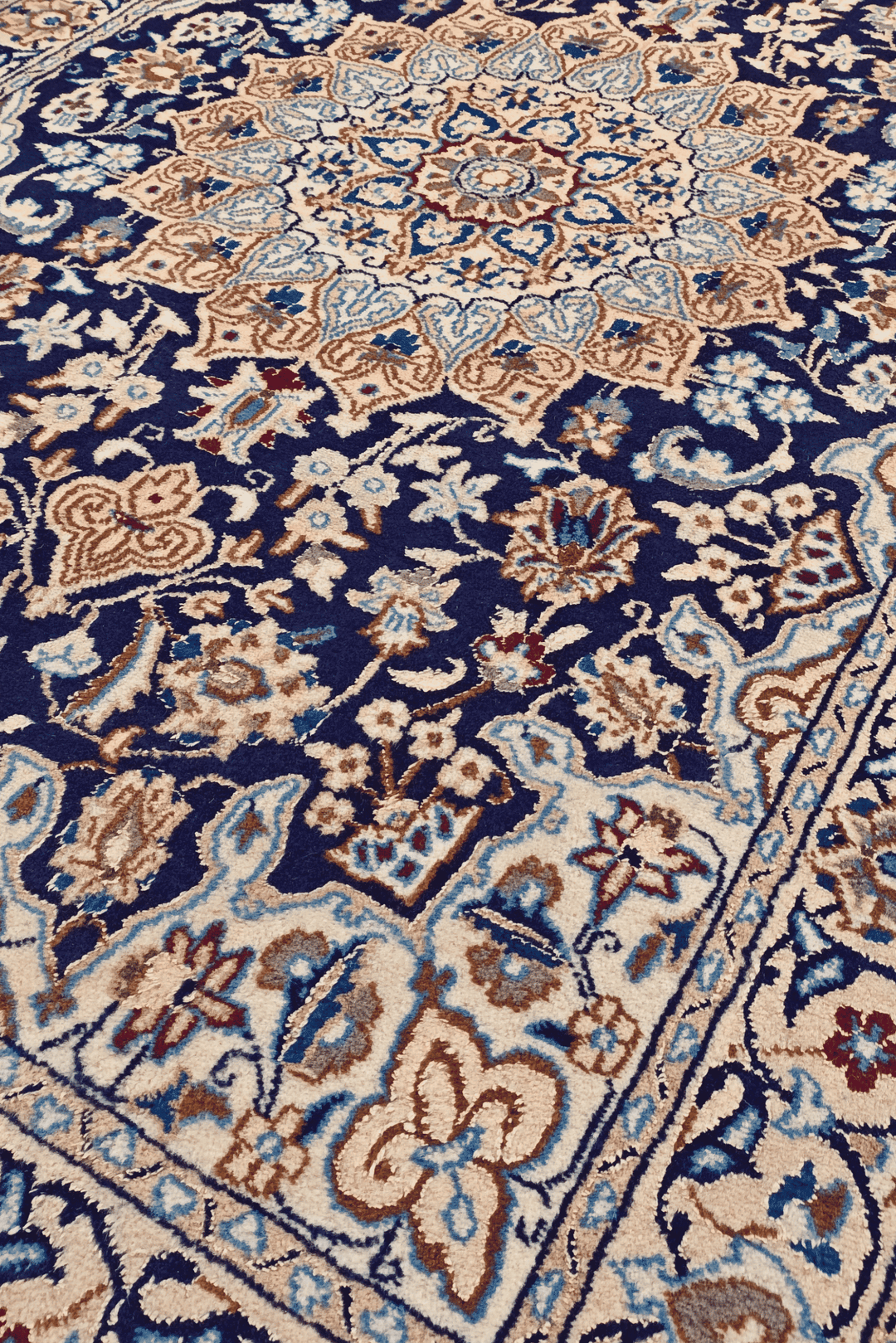 Border detail of navy Nain hand-knotted rug