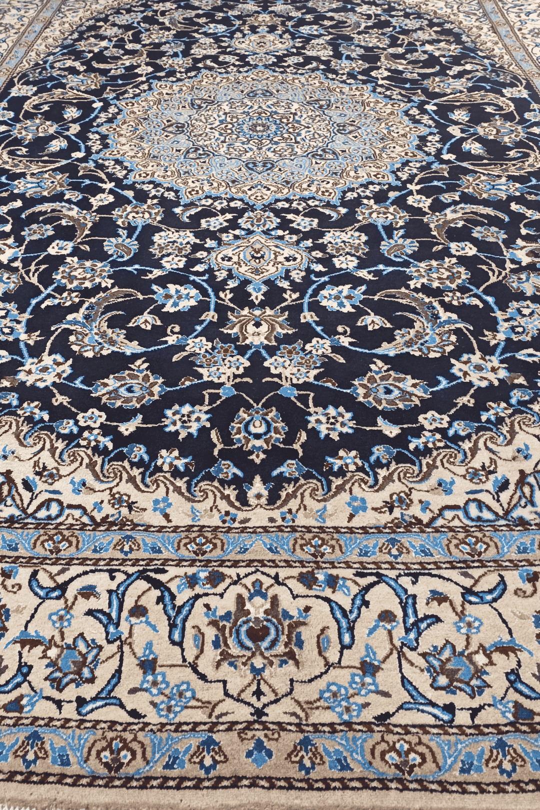 Fringe of navy and ivory Persian Nain rug