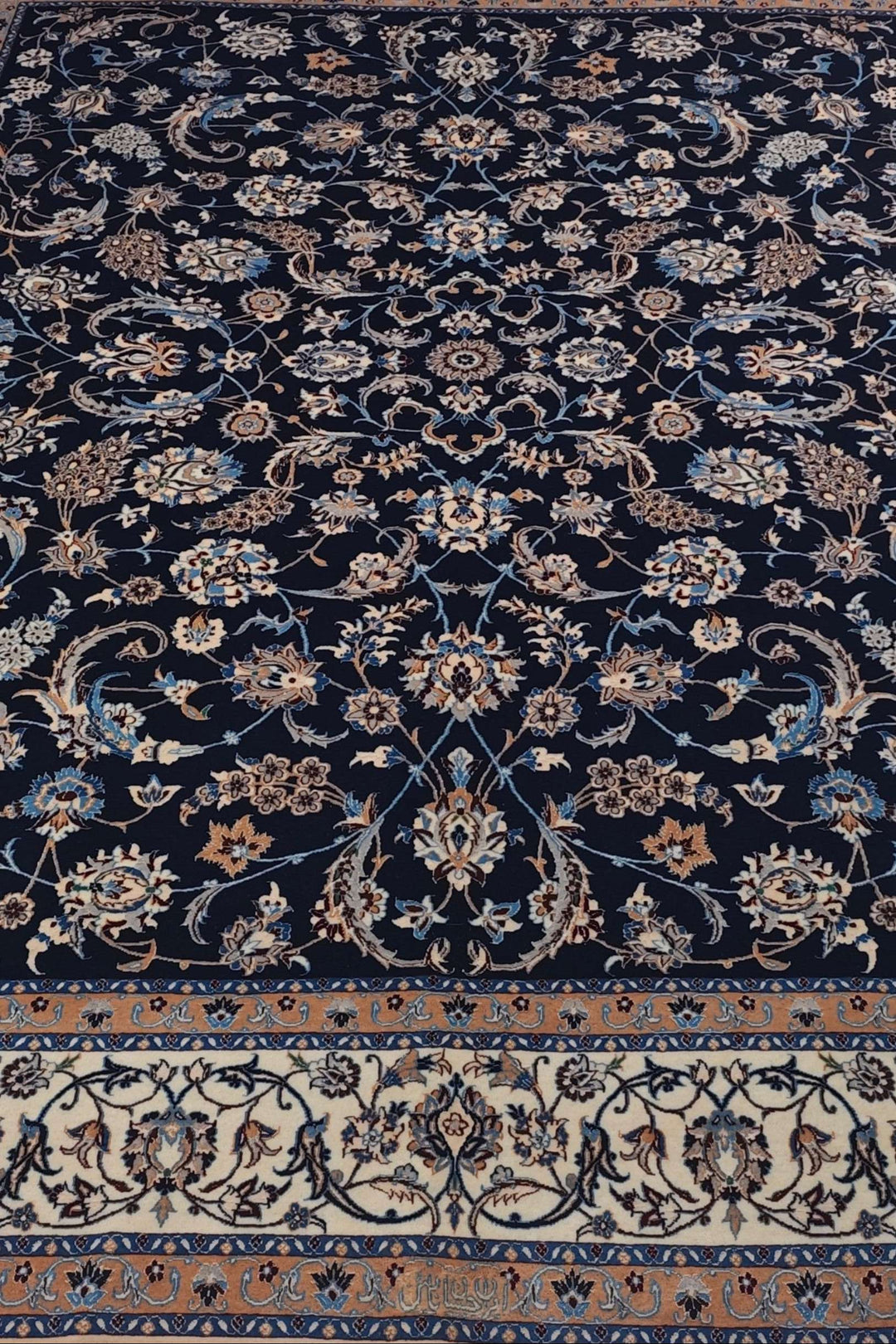 Border detail of navy ivory arabesque Nain rug