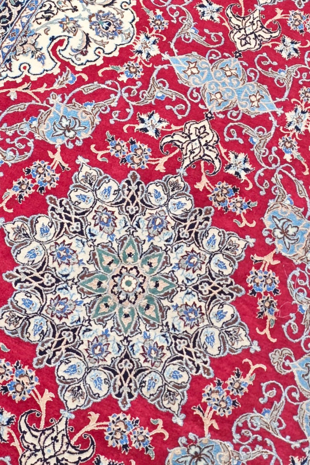 Medallion detail in red and navy on Persian Nain runner