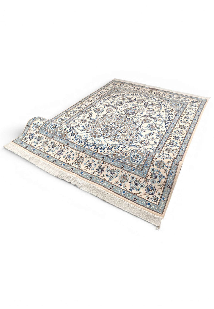 Corner of ivory blue Nain hand-knotted rug