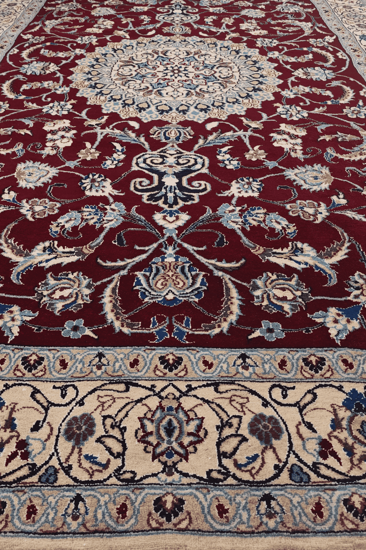 Wine red medallion Nain rug detail, Persian wool