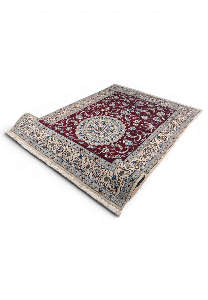 Corner of wine red Nain hand-knotted rug