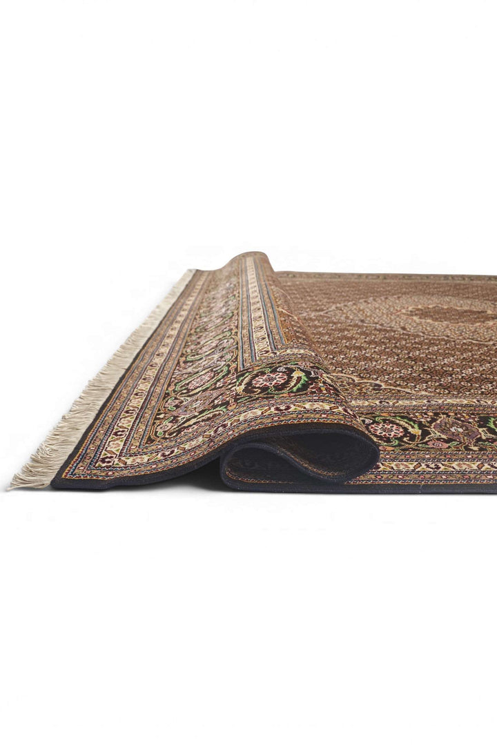 Fringe of brown mahi Persian Tabriz rug