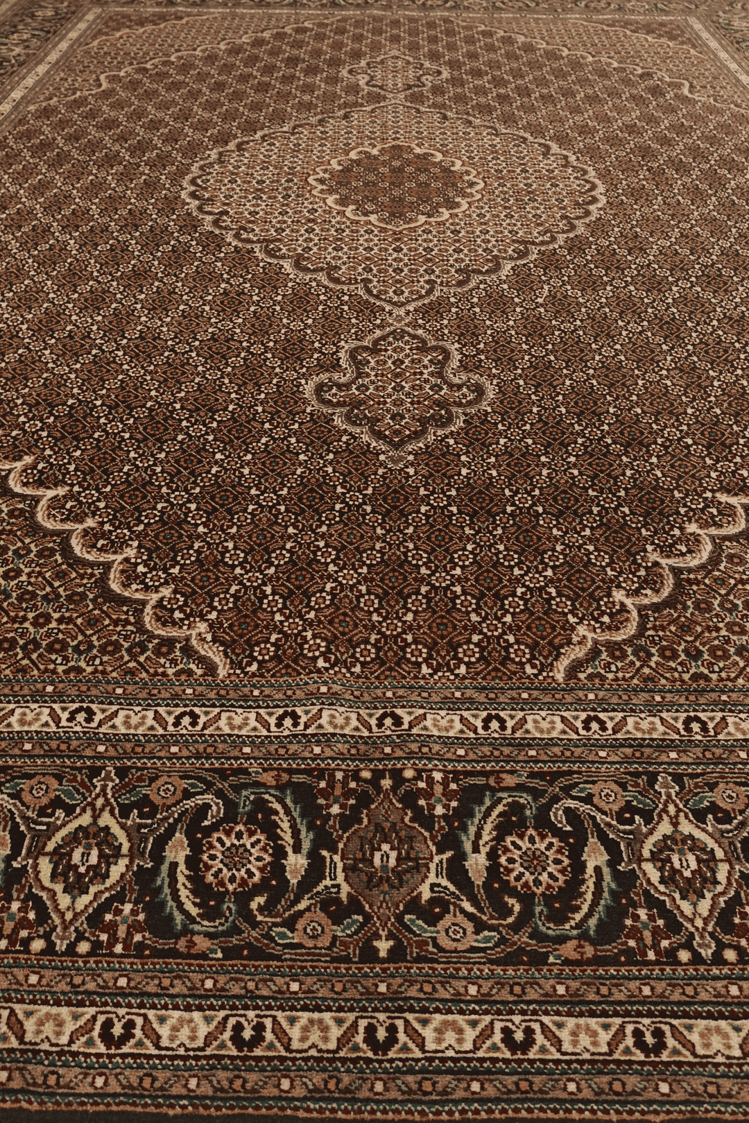 Hand-knotted wool pile of brown Tabriz rug, 205×295cm