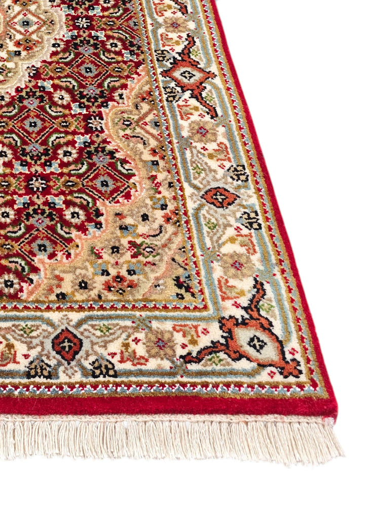 Hand-knotted Persian Tabriz rug with Herati field
