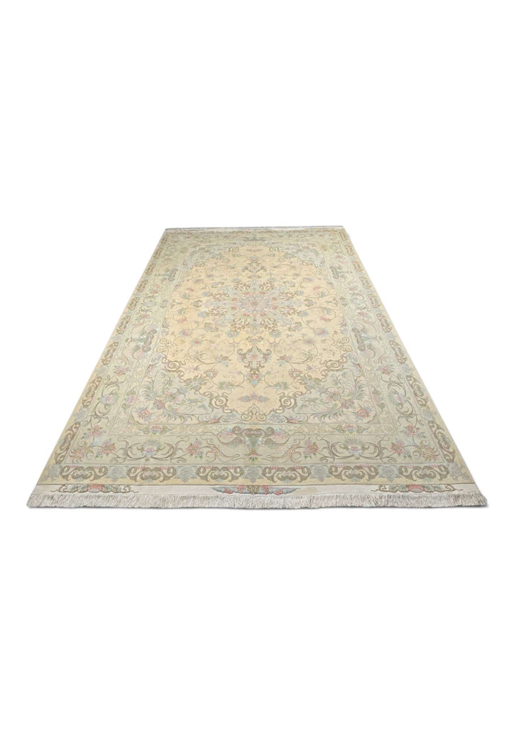 Border detail of cream soft pink Tabriz rug