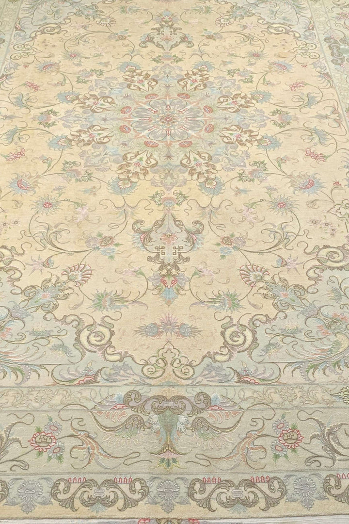 Corner of cream soft pink Tabriz hand-knotted rug