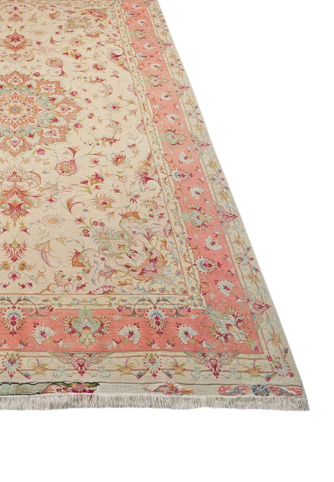 Border detail of cream coral Tabriz hand-knotted rug