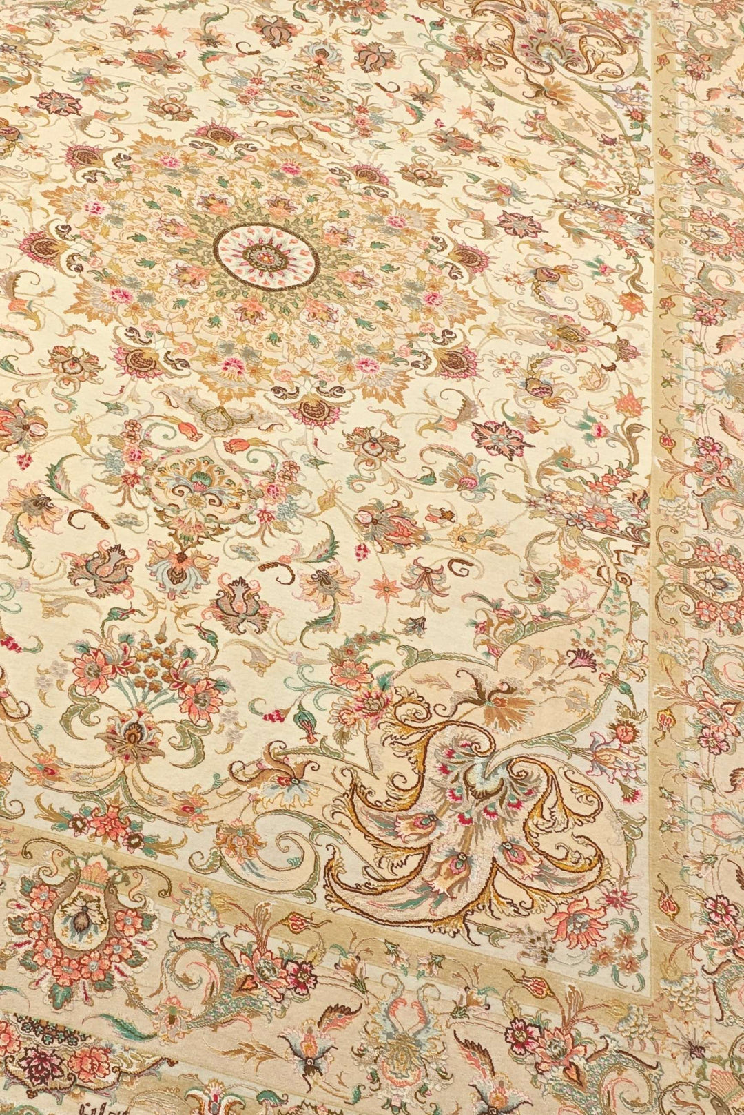 Border detail of cream gold Tabriz hand-knotted rug