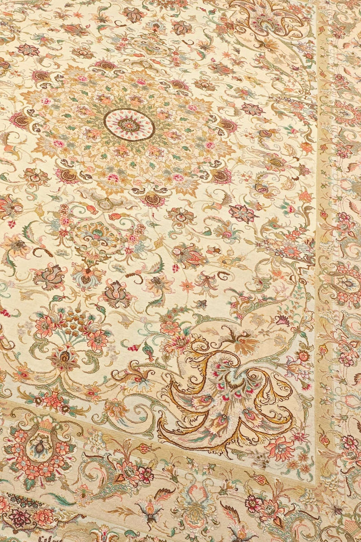 Border detail of cream gold Tabriz hand-knotted rug