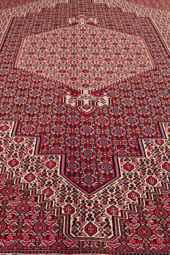Fringe of red mahi Persian Tabriz rug