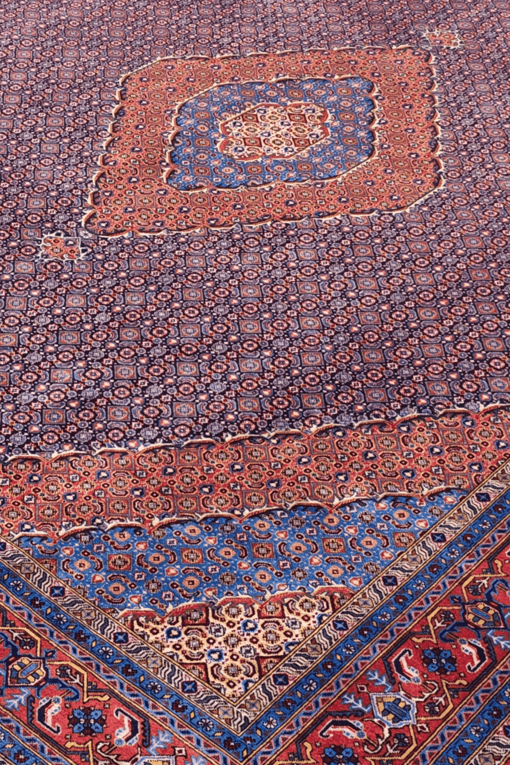 Herati medallion detail in mauve and salmon on Pakistani rug