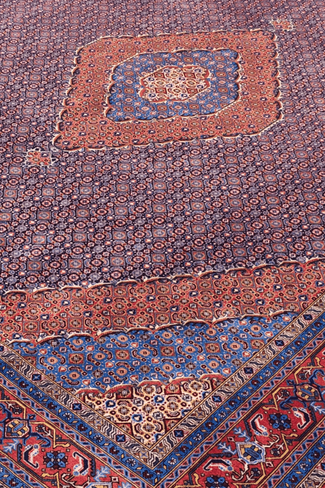 Herati medallion detail in mauve and salmon on Pakistani rug