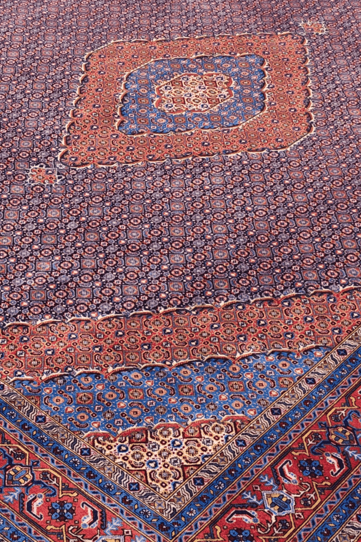 Herati medallion detail in mauve and salmon on Pakistani rug
