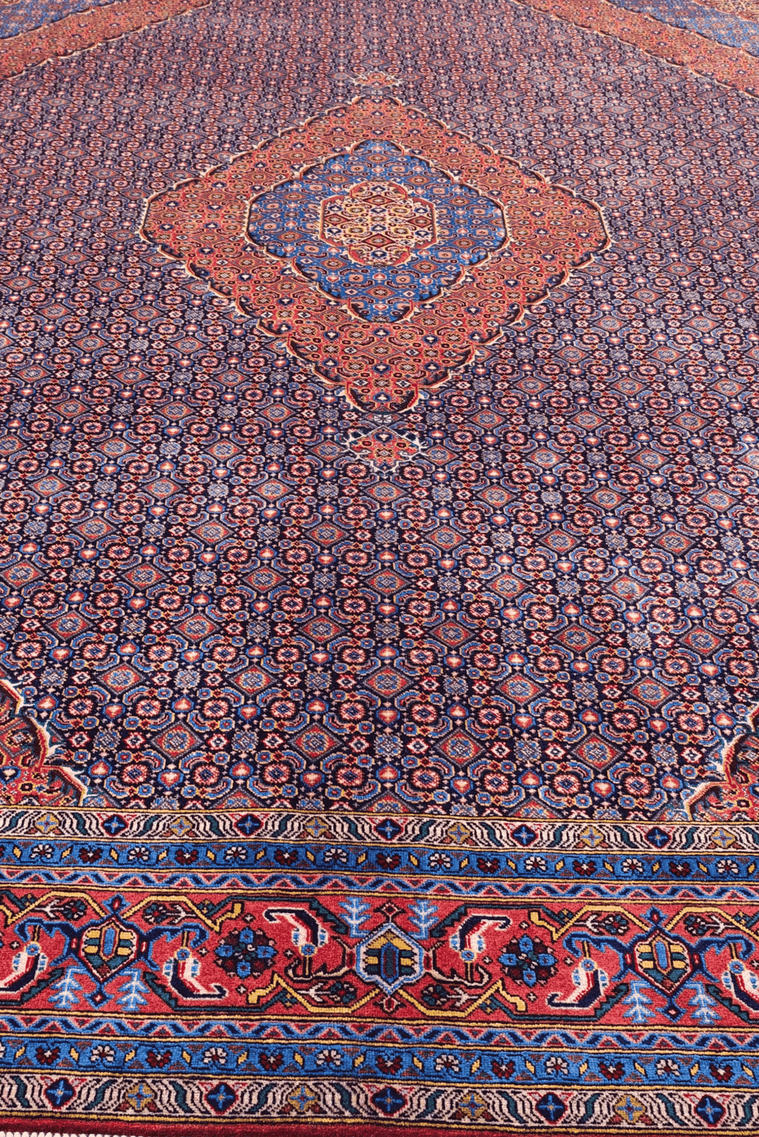 Hand-knotted mauve Pakistani rug with mahi Herati field