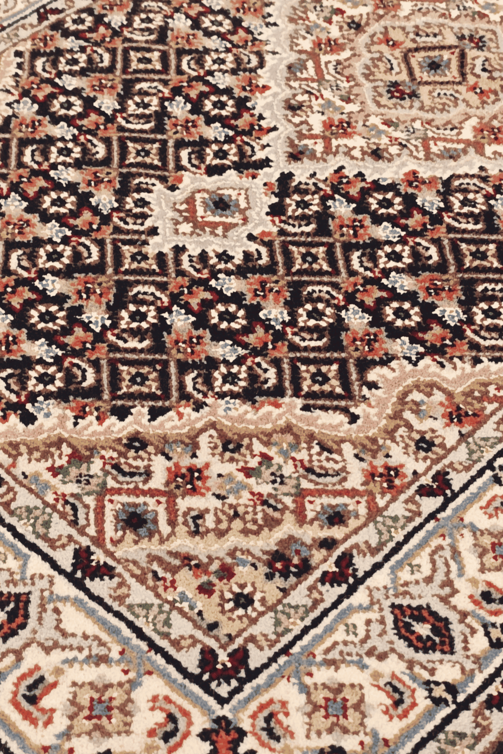 Mahi medallion detail in sandstone on Persian Tabriz rug