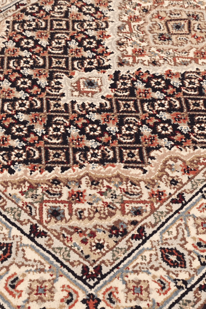 Mahi medallion detail in sandstone on Persian Tabriz rug