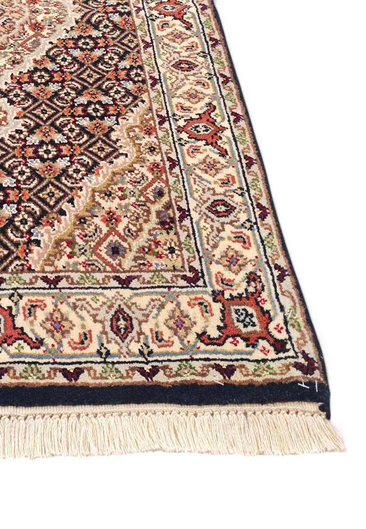 Hand-knotted Persian Tabriz rug with Herati field