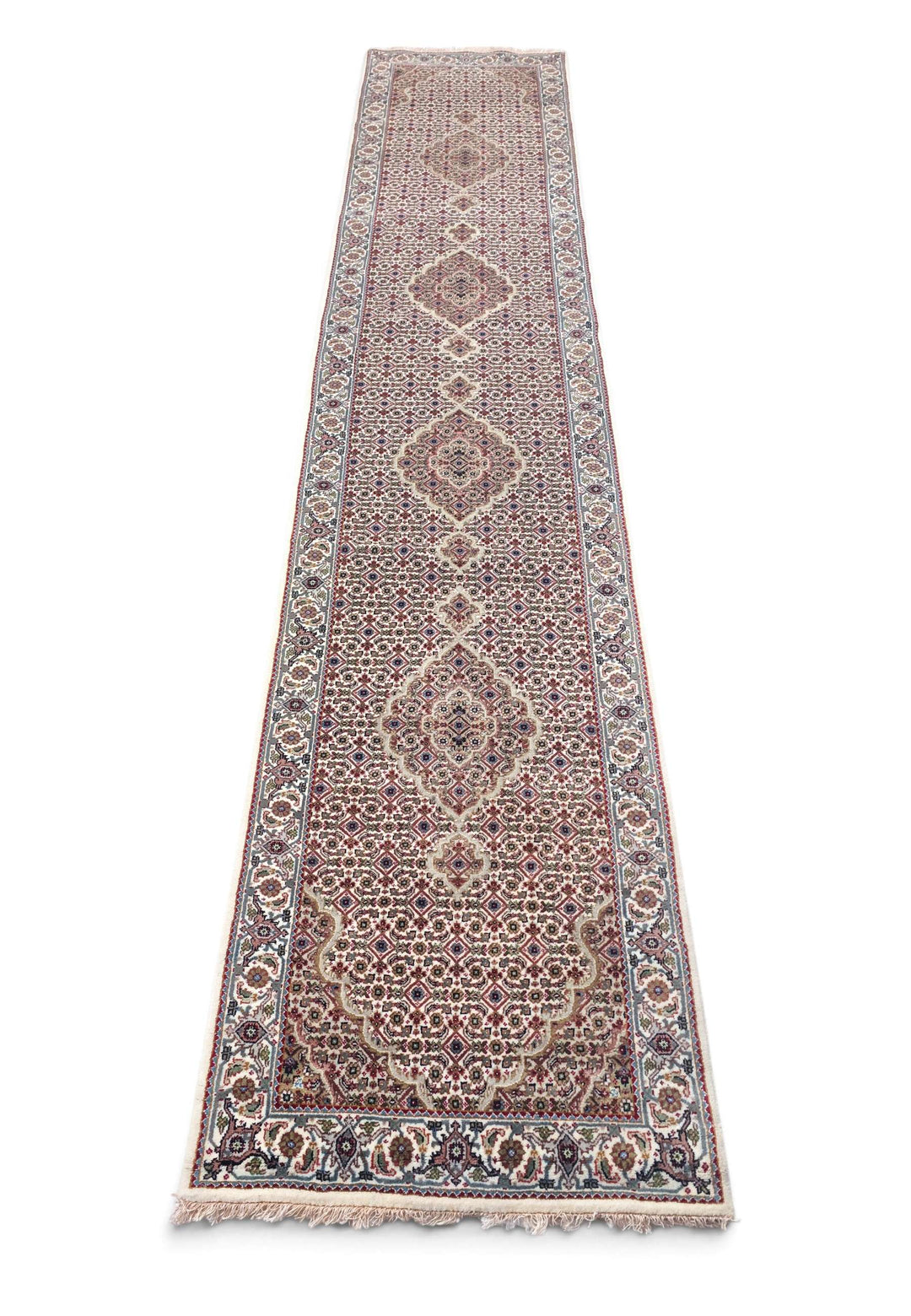 Border detail of ivory grey Tabriz hand-knotted runner