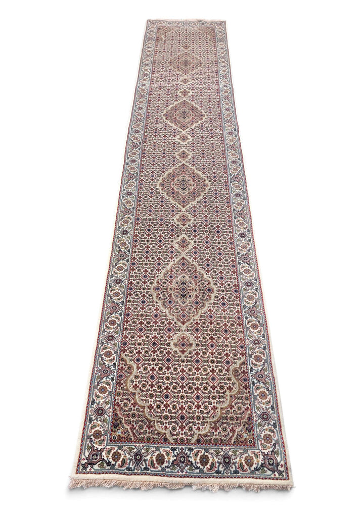 Border detail of ivory grey Tabriz hand-knotted runner