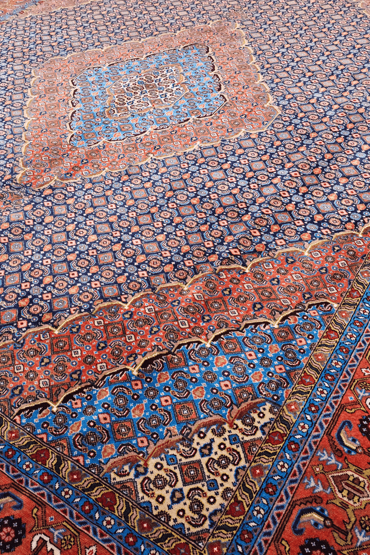Mahi medallion detail in slate blue and salmon on Pakistani rug