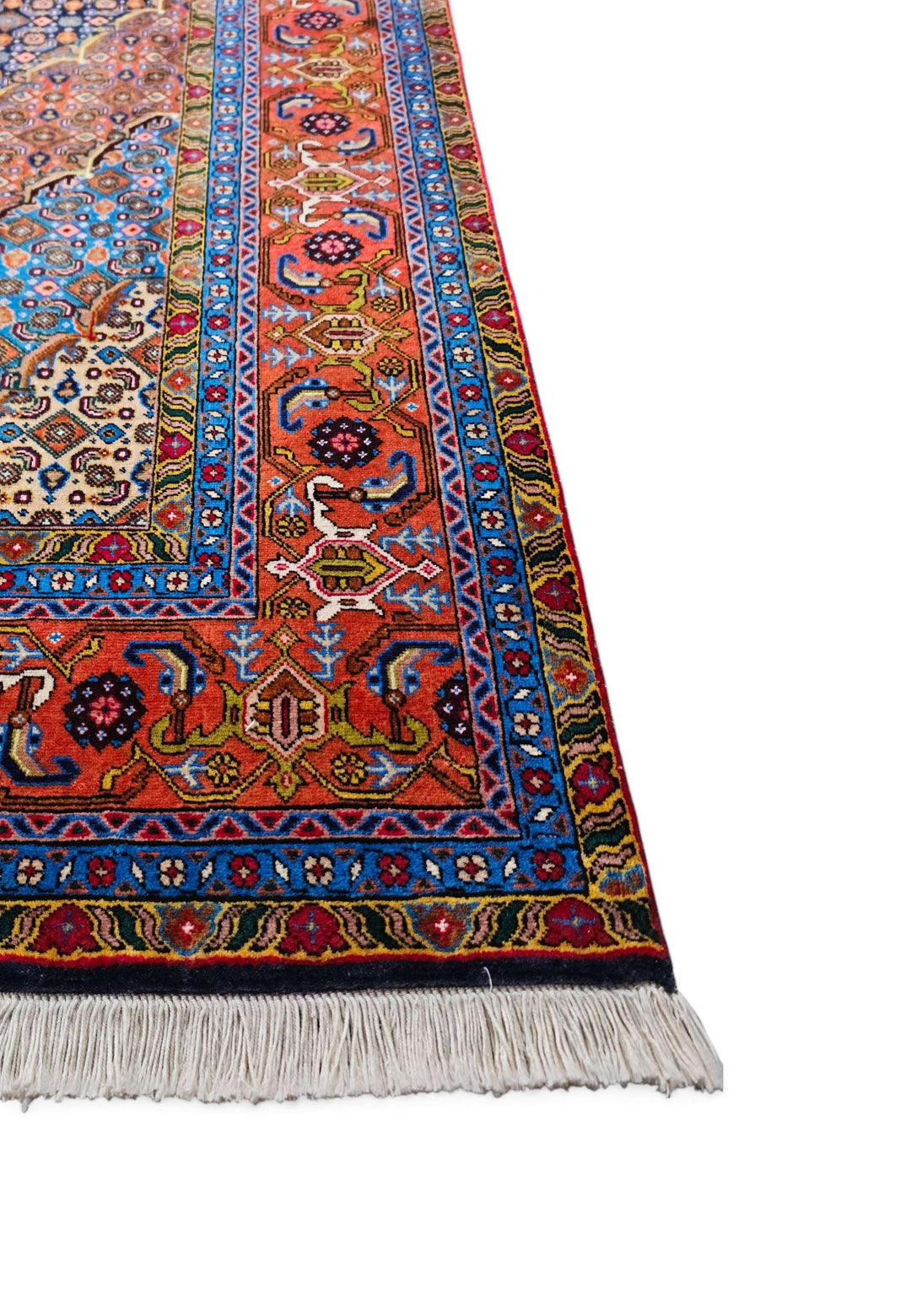 Corner of slate blue and salmon mahi hand-knotted rug