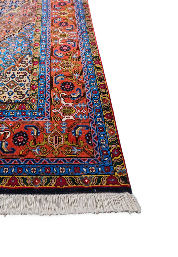 Corner of slate blue and salmon mahi hand-knotted rug